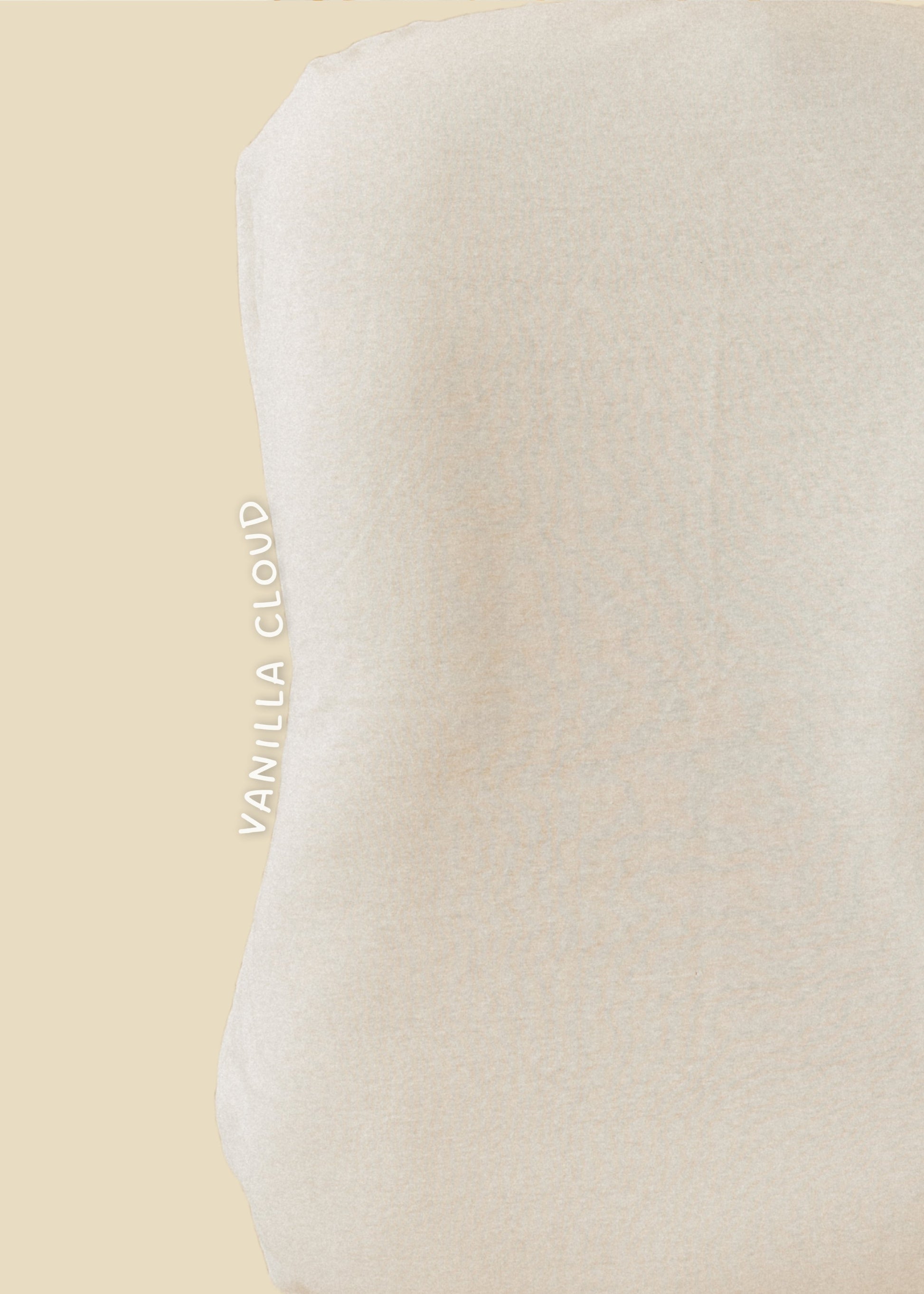 Beige pillow with 'Vanilla Cloud' branding on a beige background